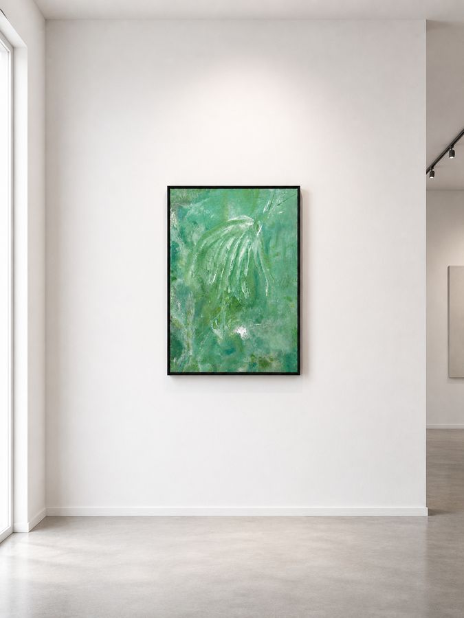 Mantle in a black float frame on a white gallery wall, lit from above, polished concrete floor below.